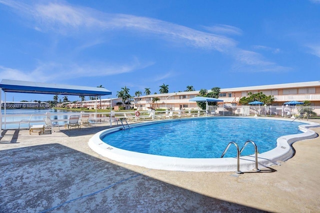 view of swimming pool with a patio area