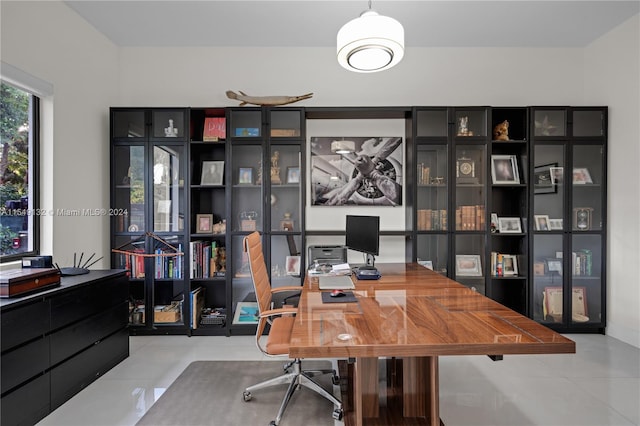 home office with light tile floors