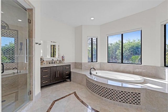 bathroom featuring vanity, shower with separate bathtub, and tile flooring