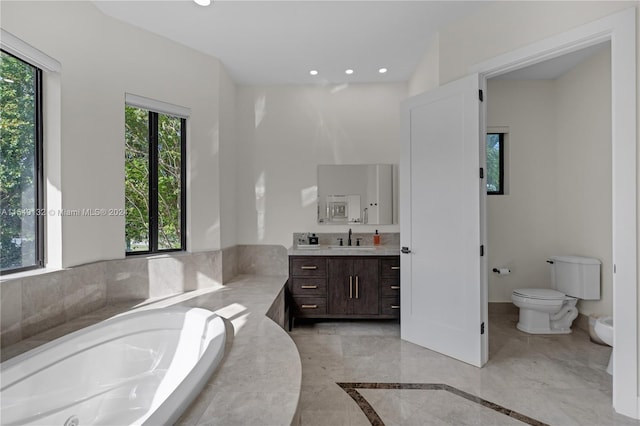 bathroom featuring toilet, tile flooring, a bath, and vanity