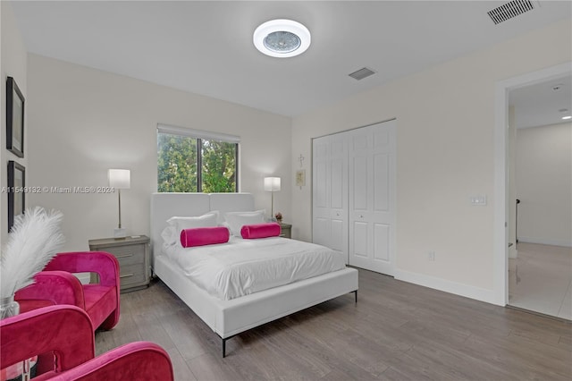 bedroom featuring tile floors and a closet