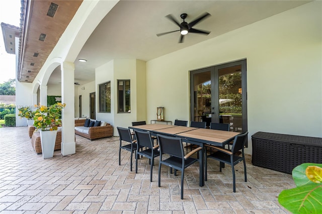 view of terrace with french doors, outdoor lounge area, and ceiling fan