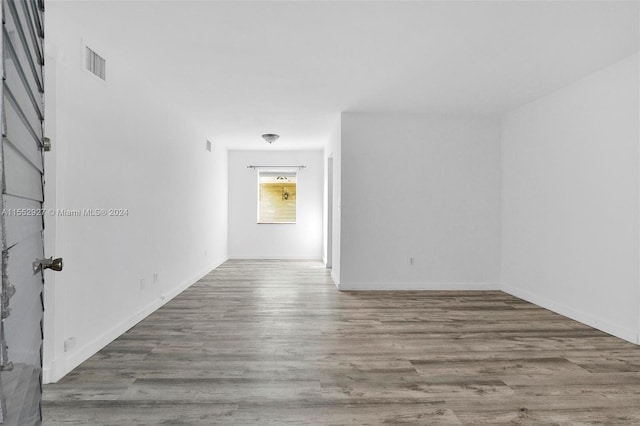 spare room featuring hardwood / wood-style flooring