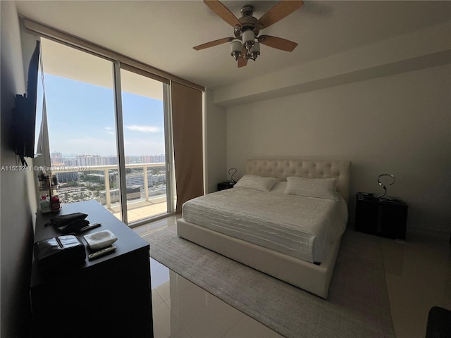 bedroom featuring floor to ceiling windows, access to exterior, ceiling fan, and light tile floors