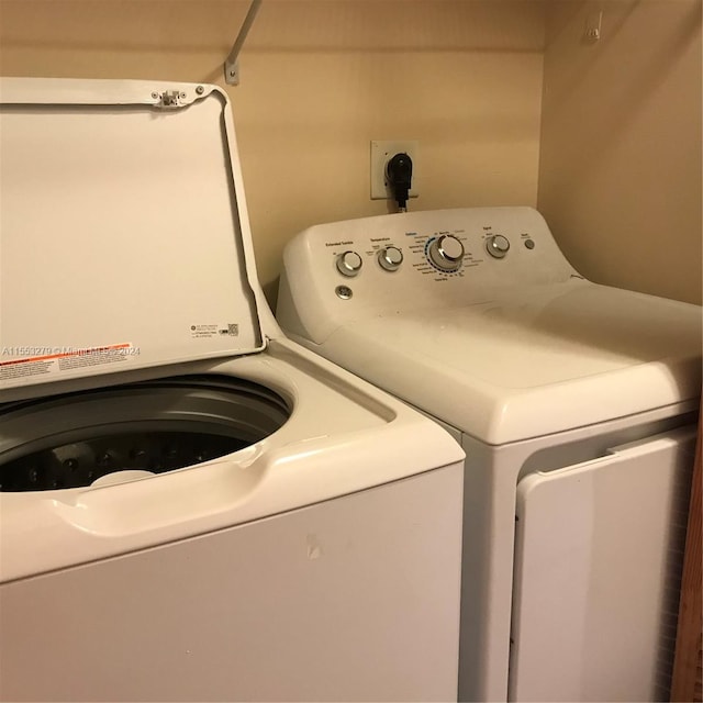 laundry area with washing machine and dryer and hookup for an electric dryer