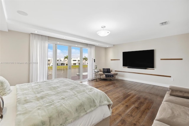 bedroom featuring access to outside and dark hardwood / wood-style floors