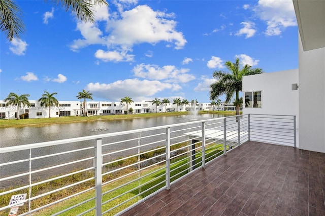 balcony featuring a water view