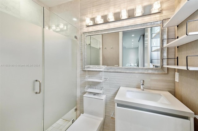 bathroom with toilet, oversized vanity, and tile walls