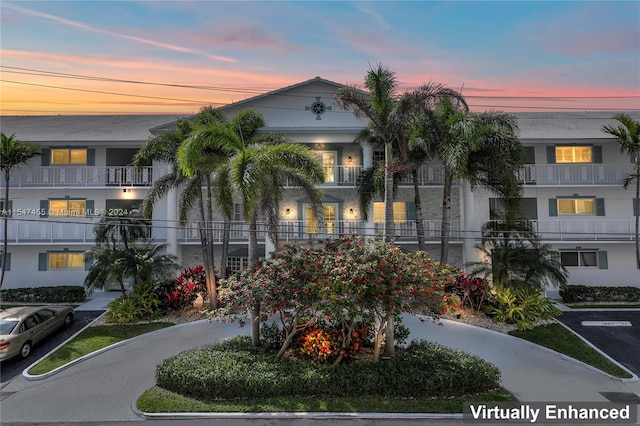 view of outdoor building at dusk