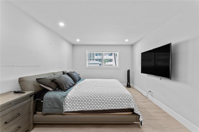 bedroom with light hardwood / wood-style flooring