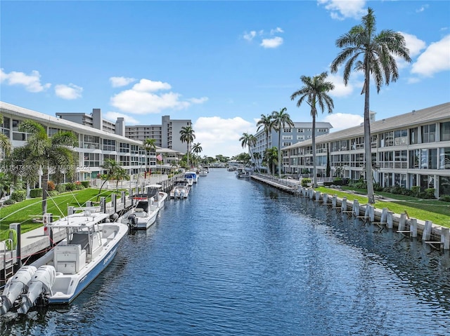 dock area featuring a water view and a yard