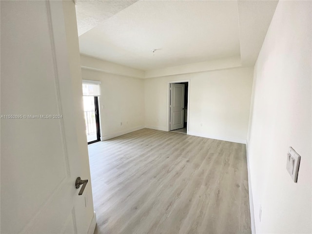 unfurnished room with light hardwood / wood-style floors