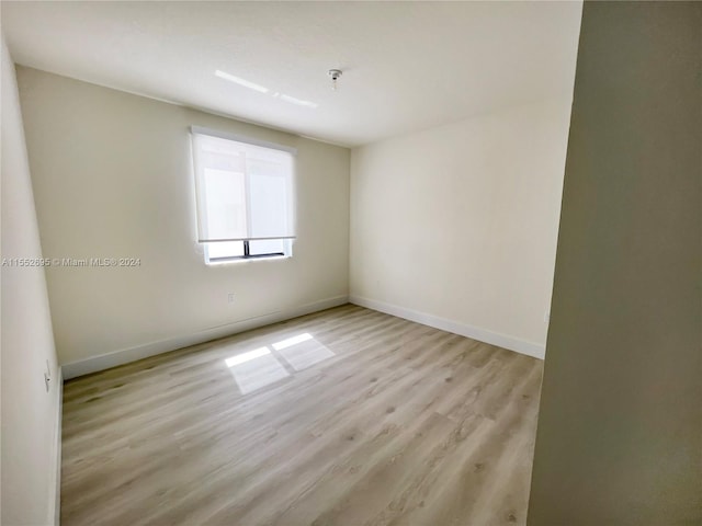 spare room featuring light wood-type flooring