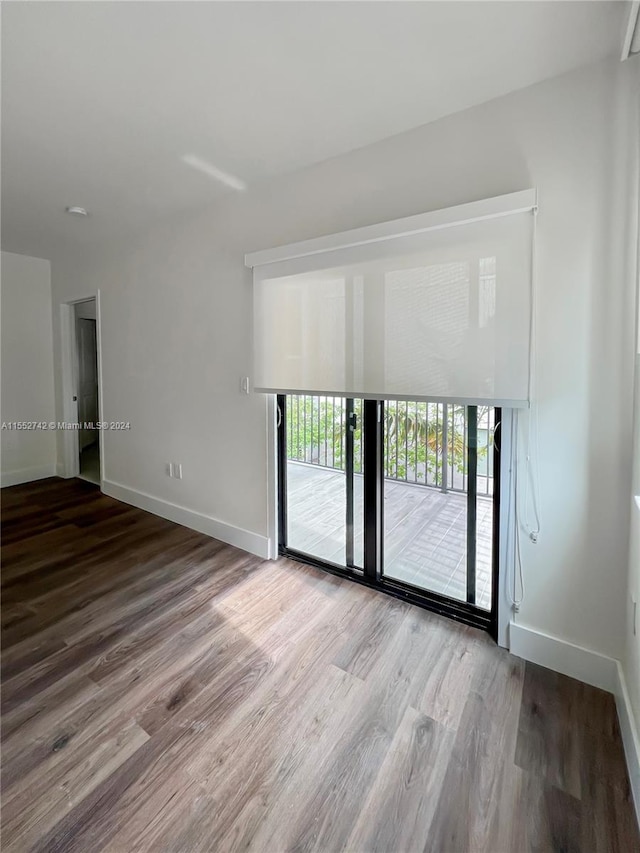 empty room featuring hardwood / wood-style floors