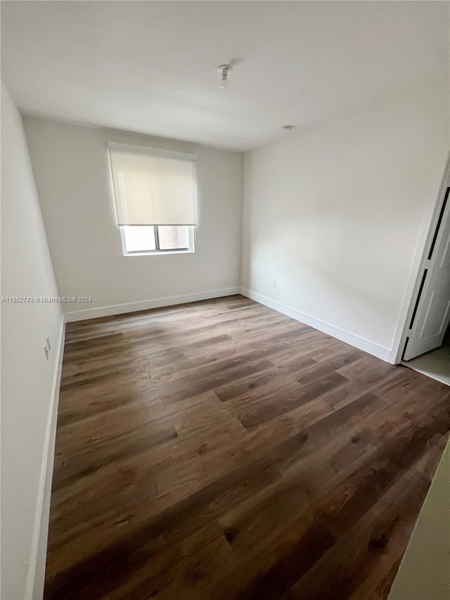 unfurnished room featuring wood-type flooring