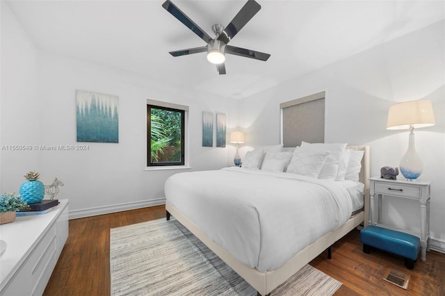 bedroom featuring dark wood-type flooring and ceiling fan