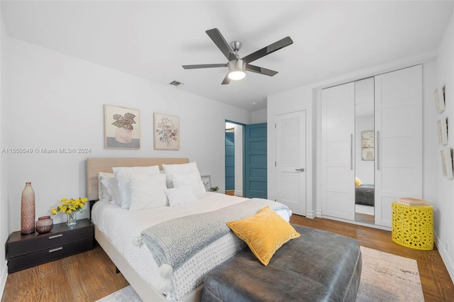 bedroom with hardwood / wood-style floors and ceiling fan