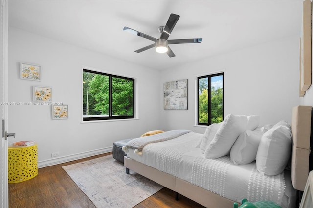 bedroom featuring dark hardwood / wood-style flooring and ceiling fan