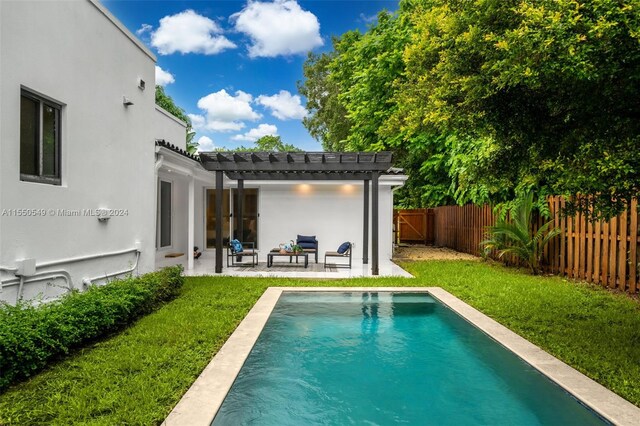 view of pool with a pergola, a lawn, and a patio