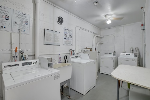 laundry room featuring sink, washer and dryer, and ceiling fan