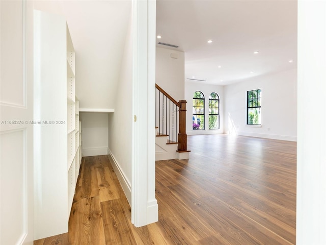 staircase featuring wood-type flooring