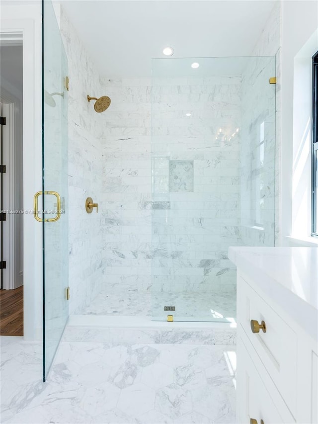 bathroom featuring vanity and walk in shower