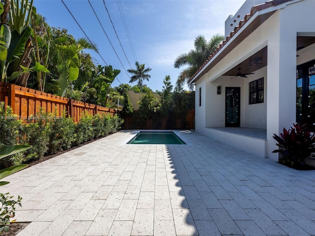 view of pool featuring ceiling fan and a patio area