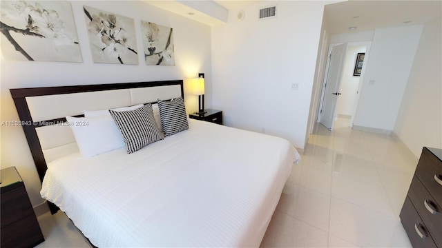 bedroom featuring light tile floors