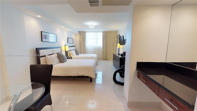 bedroom featuring light tile flooring