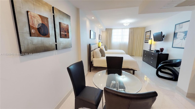 dining area featuring light tile flooring