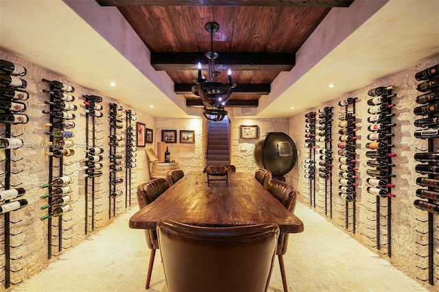 wine area with beam ceiling, wooden ceiling, and light carpet