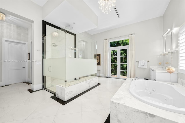 bathroom with separate shower and tub, french doors, vanity, and a notable chandelier