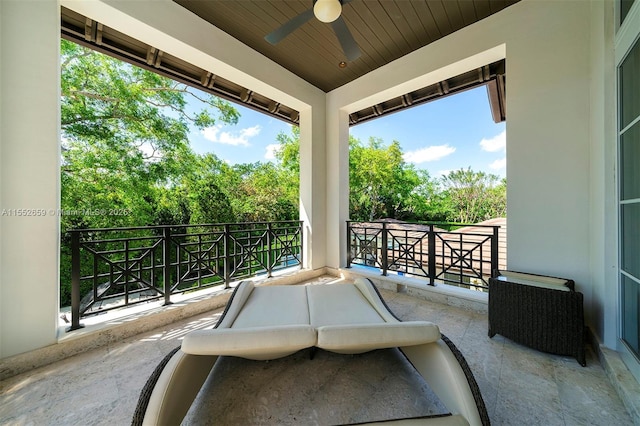 view of patio / terrace featuring ceiling fan and a balcony