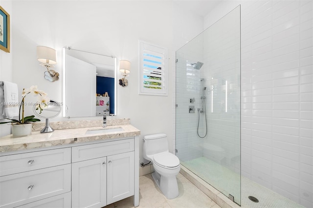 bathroom with tile patterned flooring, vanity, toilet, and a shower with door