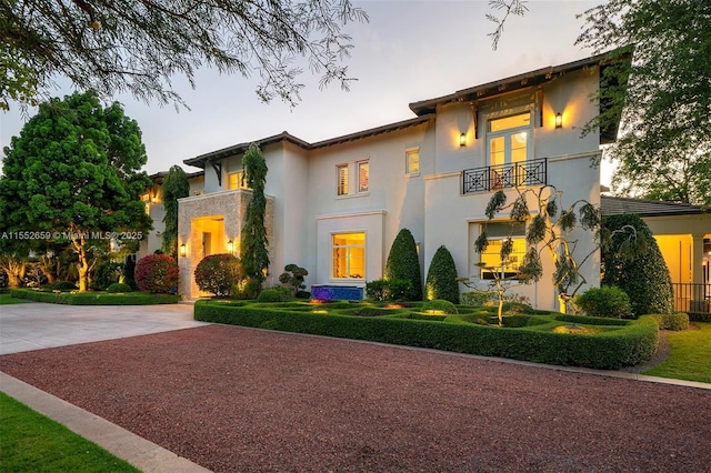 view of front of house featuring a balcony