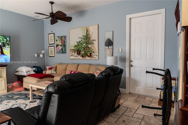 living room with light tile floors and ceiling fan