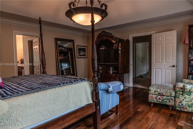 bedroom featuring ornamental molding and dark hardwood / wood-style floors