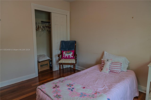 bedroom featuring a closet and dark wood-type flooring