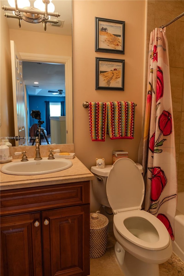 full bathroom featuring toilet, shower / tub combo, vanity, and a notable chandelier