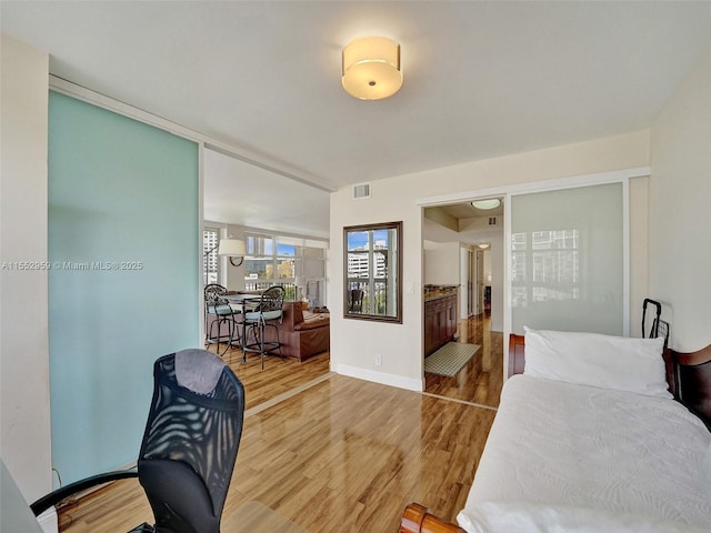 bedroom with wood-type flooring