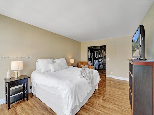 bedroom with light hardwood / wood-style flooring