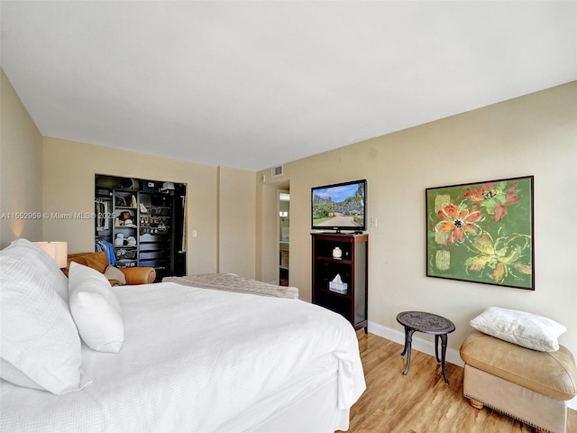 bedroom with light wood-type flooring