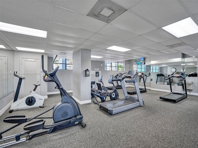 exercise room featuring a paneled ceiling