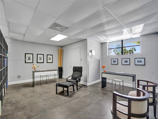 sitting room with a paneled ceiling