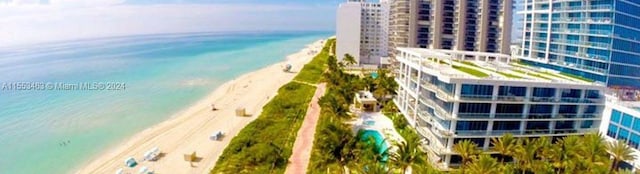 aerial view with a beach view and a water view