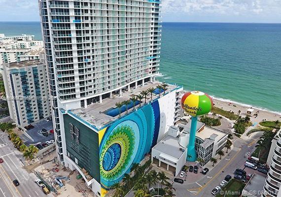 bird's eye view with a water view and a view of the beach