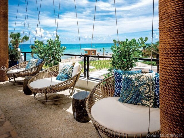 balcony featuring a water view