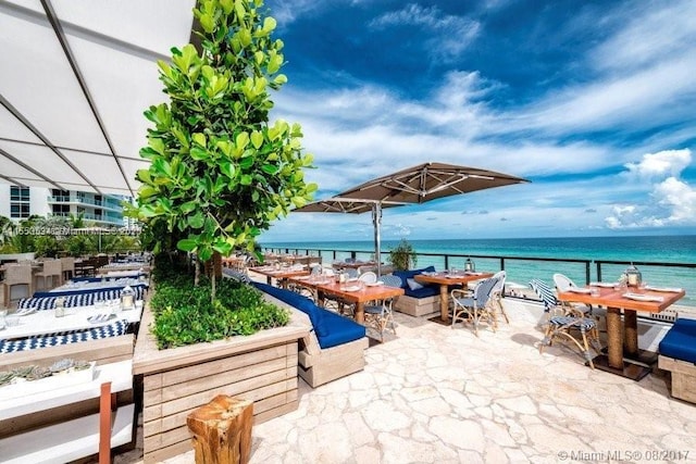 view of patio featuring a water view