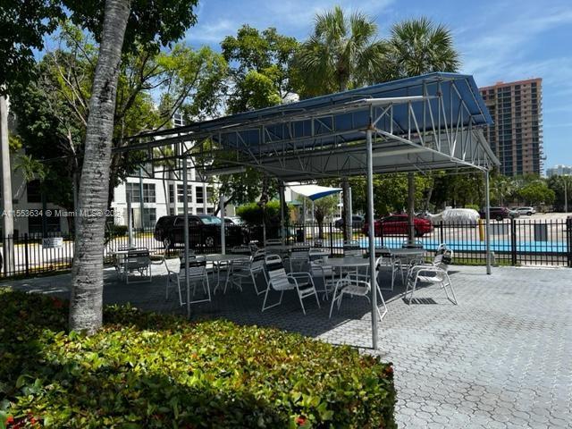 view of nearby features with a patio area and a pool