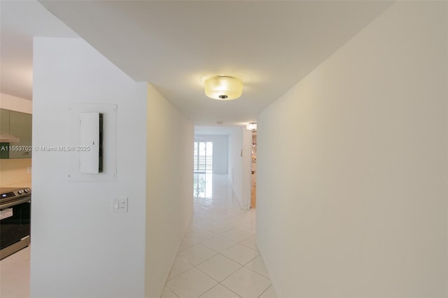 corridor with light tile patterned flooring